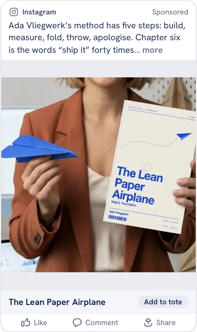 The sample ad staged as an Instagram Feed post: a square close-up of the book and a folded paper plane, with the CTA bar under the media